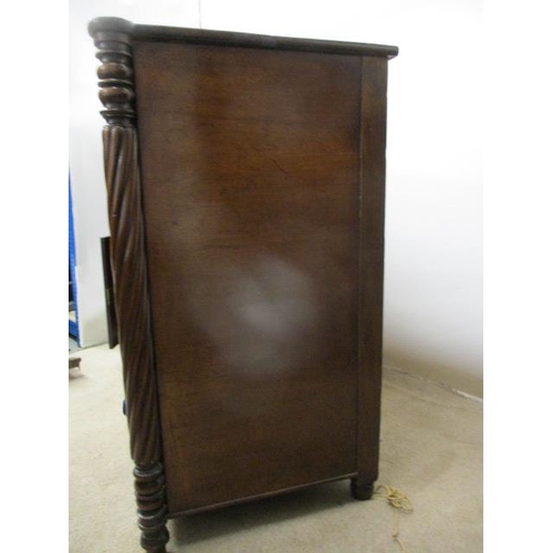 275 - An early 19th century mahogany sideboard having an in-curved front with a drawer and a panelled door... 