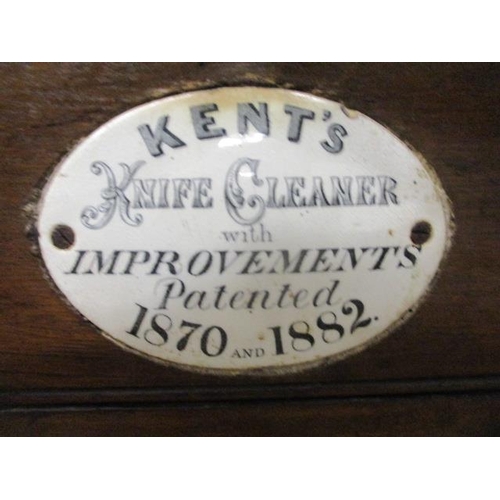 276 - A Victorian Kent's oak cased knife cleaner on a cast iron stand with splayed legs, 42