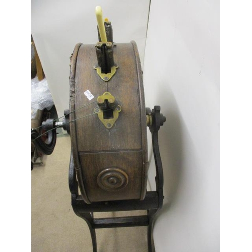 276 - A Victorian Kent's oak cased knife cleaner on a cast iron stand with splayed legs, 42