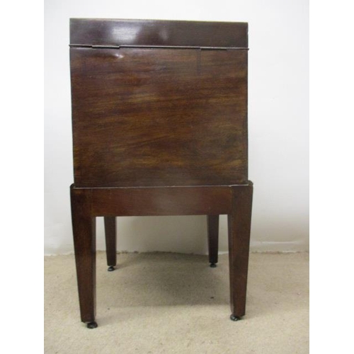 278 - A George III boxwood, string inlaid mahogany cellerette having a hinged, arched top over straight si... 