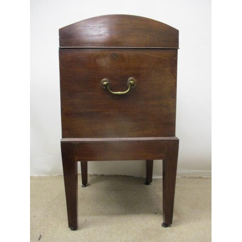 278 - A George III boxwood, string inlaid mahogany cellerette having a hinged, arched top over straight si... 