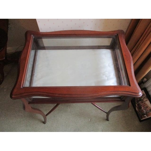 285 - WITHDRAWN  An Edwardian mahogany display table with a hinged, glazed top over glazed sides, raised o... 