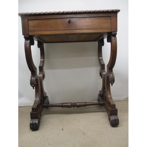 297 - A William VII rosewood work table, the top having a gadrooned edge over a drawer, a slide and C scro... 