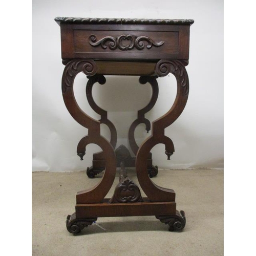 297 - A William VII rosewood work table, the top having a gadrooned edge over a drawer, a slide and C scro... 