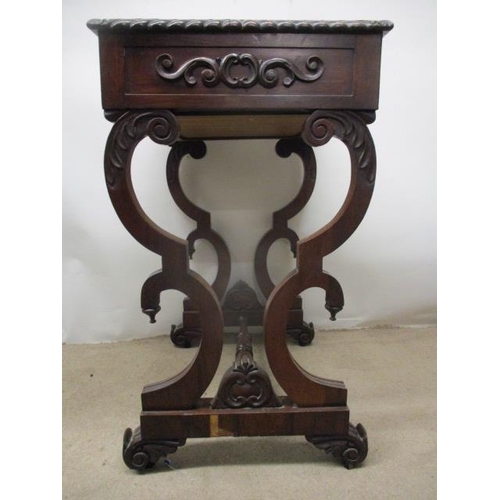 297 - A William VII rosewood work table, the top having a gadrooned edge over a drawer, a slide and C scro... 