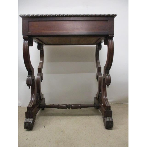 297 - A William VII rosewood work table, the top having a gadrooned edge over a drawer, a slide and C scro... 