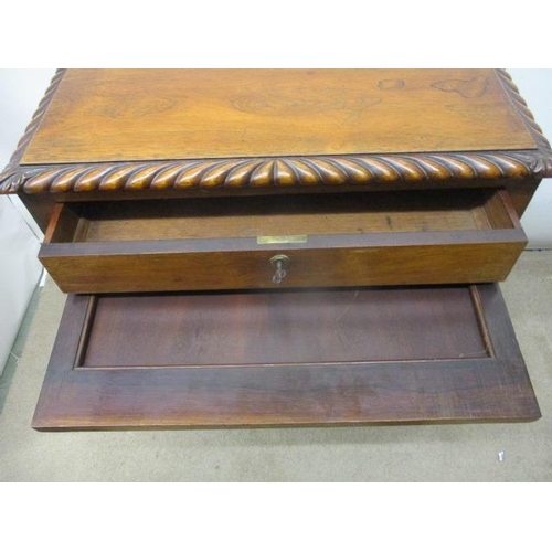 297 - A William VII rosewood work table, the top having a gadrooned edge over a drawer, a slide and C scro... 