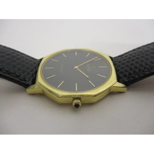 5 - A Concorde gents quartz 18ct gold wristwatch having a black dial, gilt baton markers in an octagonal... 