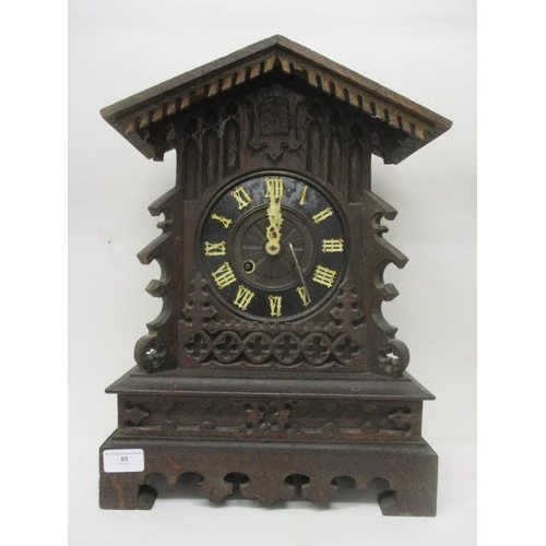 65 - A late 19th century Black Forest, oak, carved cuckoo clock, the movement signed G H S for Gordian He... 