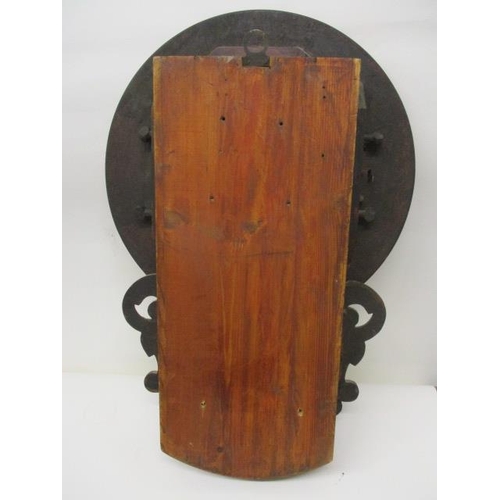 66 - A late 19th/early 20th century mahogany wall clock, the 12