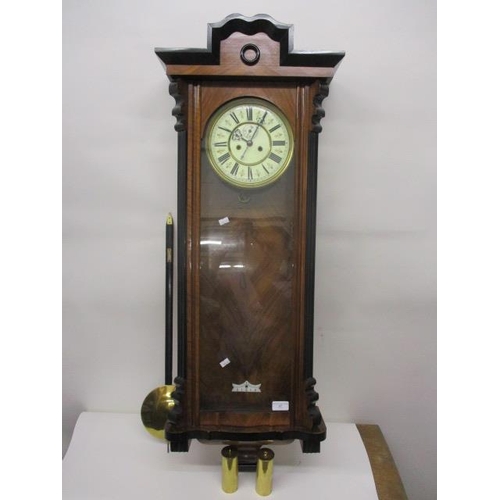 67 - A late 19th century walnut Vienna wall clock having an 8 day movement, circular enamel dial with Rom... 