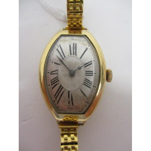 74 - An Art Deco manual wind, 18ct gold wristwatch having silvered dial with Roman numerals and spade han... 