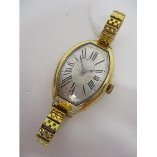 74 - An Art Deco manual wind, 18ct gold wristwatch having silvered dial with Roman numerals and spade han... 