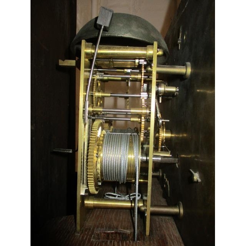 77 - An early 18th century oak longcase clock, with eight day strike on bell movement, regulated by a pen... 