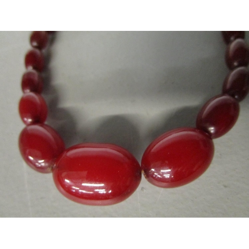 270 - A phenolic Bakelite, cherry red, graduated bead necklace, 21.58g