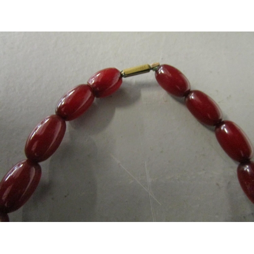 270 - A phenolic Bakelite, cherry red, graduated bead necklace, 21.58g