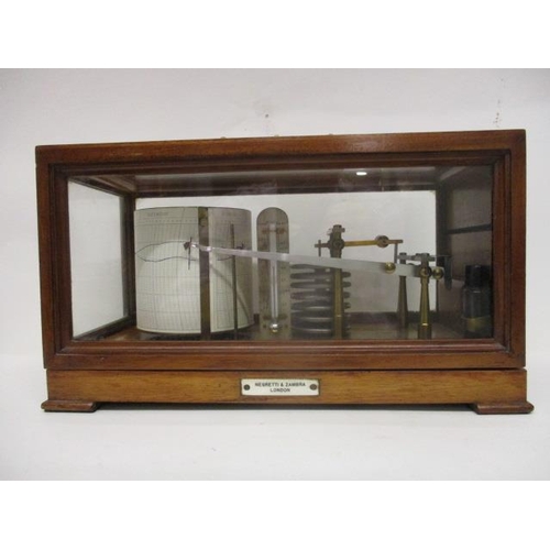 293 - A Negretti and Zambra mahogany and glazed, cased barograph with a hinged top and label, 7