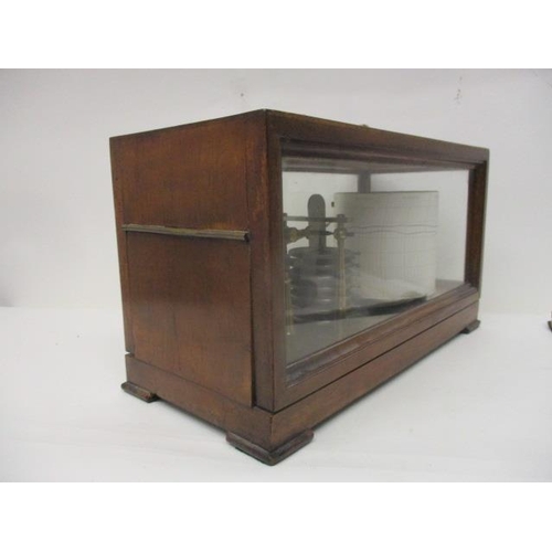 293 - A Negretti and Zambra mahogany and glazed, cased barograph with a hinged top and label, 7