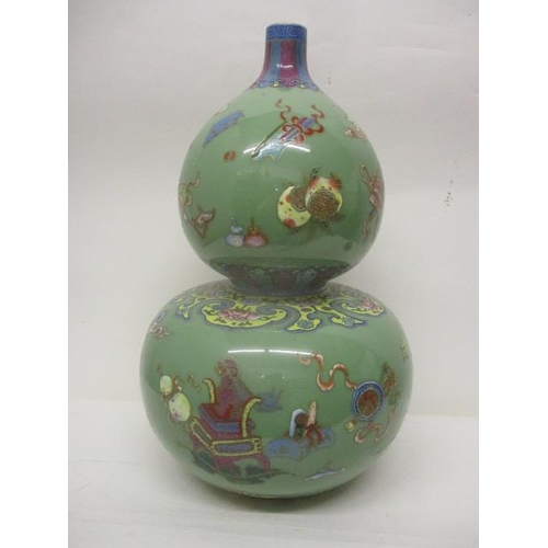 295 - A 19th century Chinese Celadon glazed, double gourd vase decorated with fruit, a vase, a dog, boxes,... 