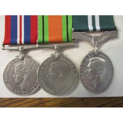 309 - Three WWII medals, Defence, 1939-1945 and Air Efficiency Award, reputedly awarded to 840431 Corporal... 