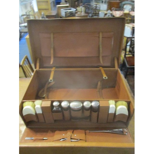 99 - A 1930s brown leather gentleman's fitted suitcase with locks, a buckled, fold over panel to the lid ... 