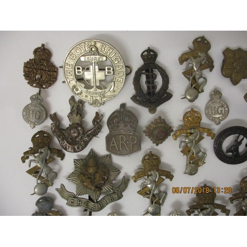 122 - Fifty mainly military badges to include RAF, The Boys Brigade, ARP and others