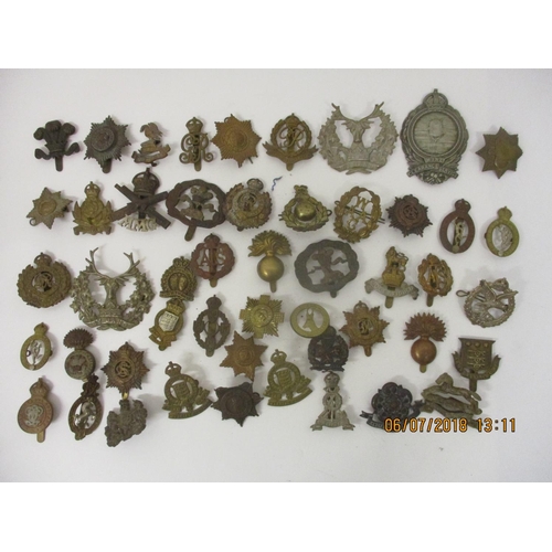 124 - Fifty military badges to include Prince of Wales Vols, Training Corps, WAAG and others