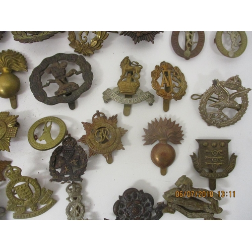 124 - Fifty military badges to include Prince of Wales Vols, Training Corps, WAAG and others