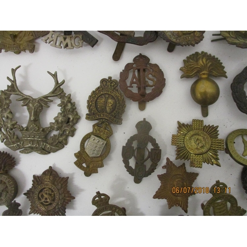 124 - Fifty military badges to include Prince of Wales Vols, Training Corps, WAAG and others