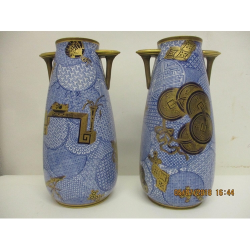 128 - A pair of late 19th century Royal Worcester china vases of ovoid form with angular handles, decorate... 