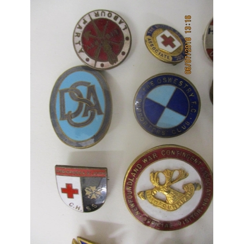 123 - Fifty Military and other enamelled and metal badges to include WVS Civil Defence, Australian Branch ... 