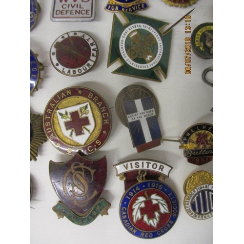 123 - Fifty Military and other enamelled and metal badges to include WVS Civil Defence, Australian Branch ... 