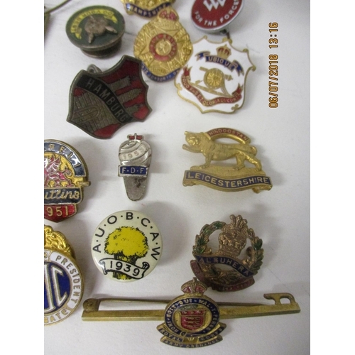 123 - Fifty Military and other enamelled and metal badges to include WVS Civil Defence, Australian Branch ... 