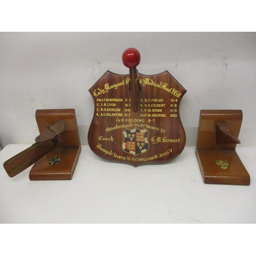 132 - 1950s Racing rowing boat related items to include a rudder and bow section bookends and the prow sec... 