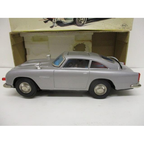 14 - An ASC Aston-Martin Mystery Action toy car, battery operated, 11