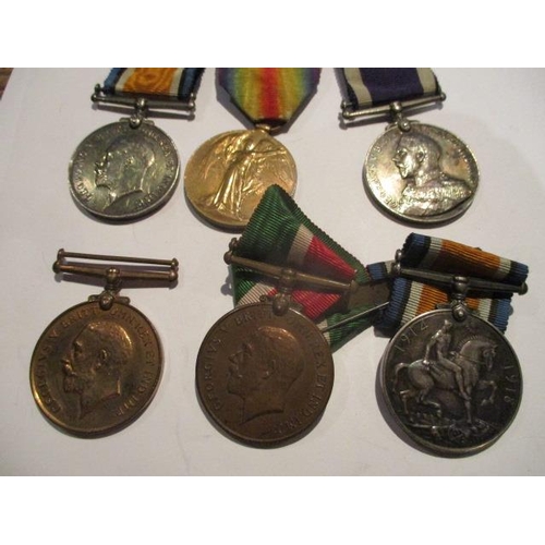 291 - WW1 medals comprising a group of three British War, Victory and a Long Service and Good Conduct Nava... 