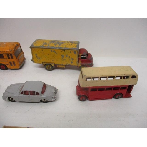 46 - Nine Dinky Toys diecast model vehicles to include a bus, a Jaguar 3.4 Lt, a Royal Mail van, a Rolls ... 