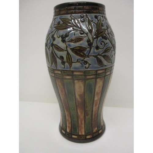 77 - A Royal Doulton stoneware vase decorated with leaves and berries over brown and green stripes, stamp... 