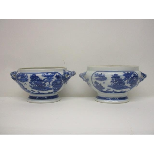 79 - A pair of mid 18th century Chinese blue and white oval tureens with twin crossover handles on a spla... 