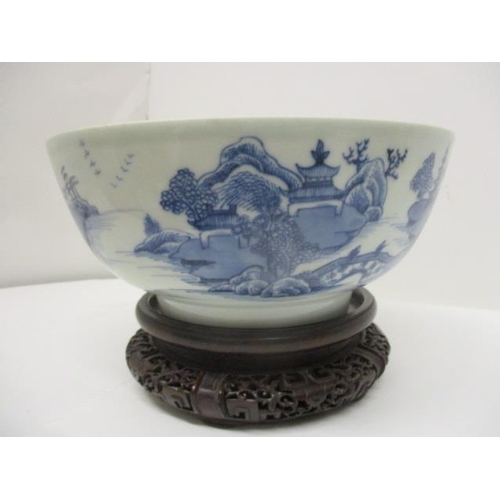 80 - A late 18th century Chinese blue and white bowl, the interior decorated with flowers and foliage and... 