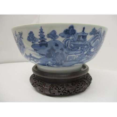 80 - A late 18th century Chinese blue and white bowl, the interior decorated with flowers and foliage and... 