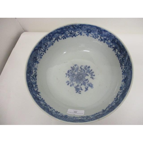 80 - A late 18th century Chinese blue and white bowl, the interior decorated with flowers and foliage and... 