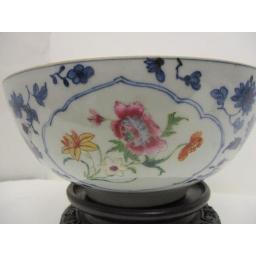 81 - A late 18th century Chinese bowl decorated with panels of polychrome flowers, blue and white flowers... 