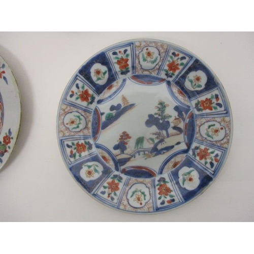 82 - Three late 18th century Chinese plates, one decorated with a band of dragons, a river, a bridge, a f... 