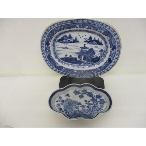 86 - Two late 18th century Chinese blue and white dishes, one with a lobed edge decorated with a garden s... 