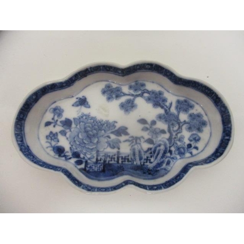 86 - Two late 18th century Chinese blue and white dishes, one with a lobed edge decorated with a garden s... 