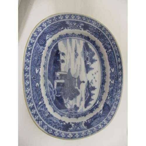 86 - Two late 18th century Chinese blue and white dishes, one with a lobed edge decorated with a garden s... 