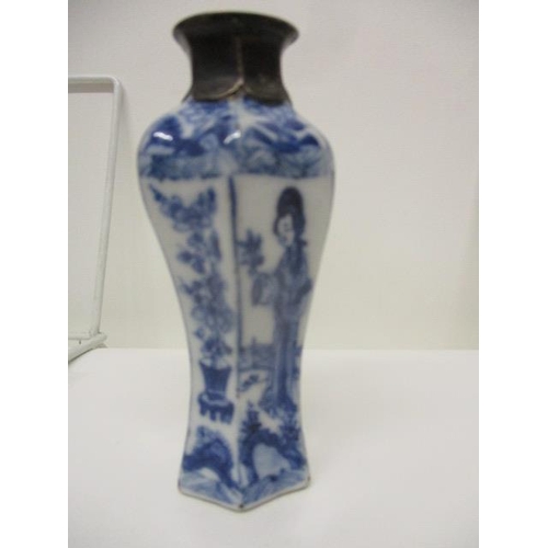 89 - A Kangxi Chinese blue and white perfume bottle of waisted, inverted hexagonal form, decorated with a... 