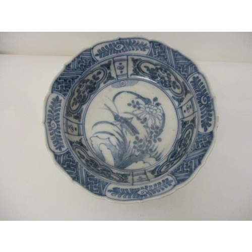 85 - A 19th century, possibly Chinese blue and white bowl decorated with a cricket and flowers and panels... 