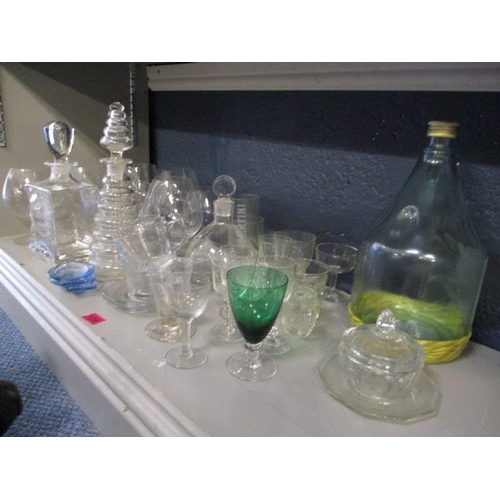 128 - A mixed lot of glass to include three decanters, brandy glasses and other miscellaneous items